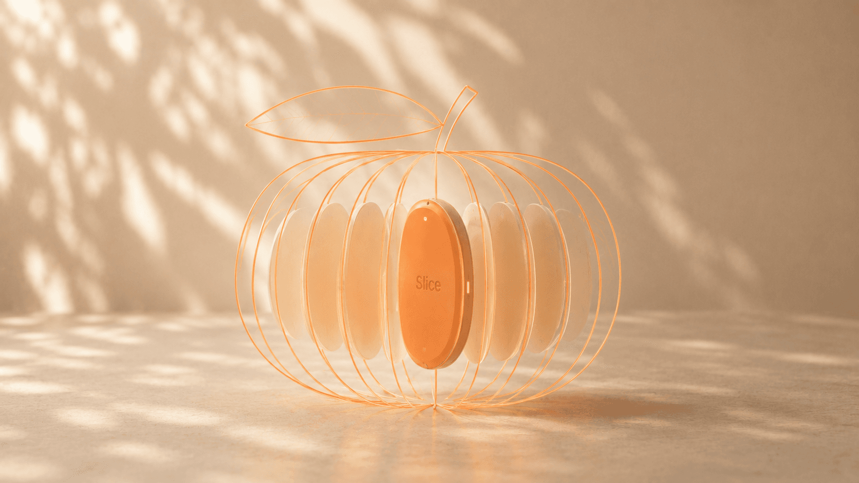 Orange Slice wearable nested inside an abstract whole-fruit form